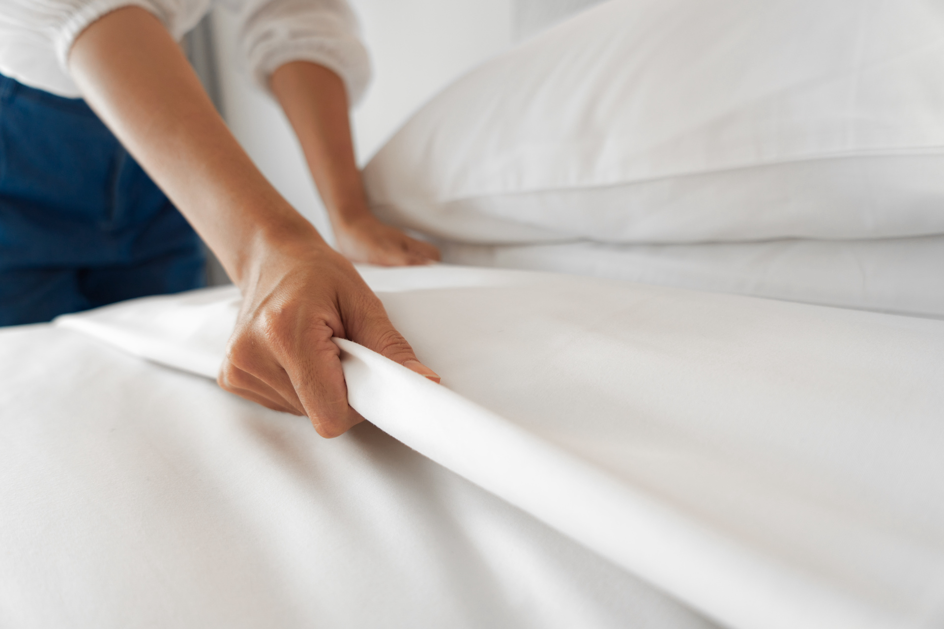 Housekeeper cleaning a hotel room