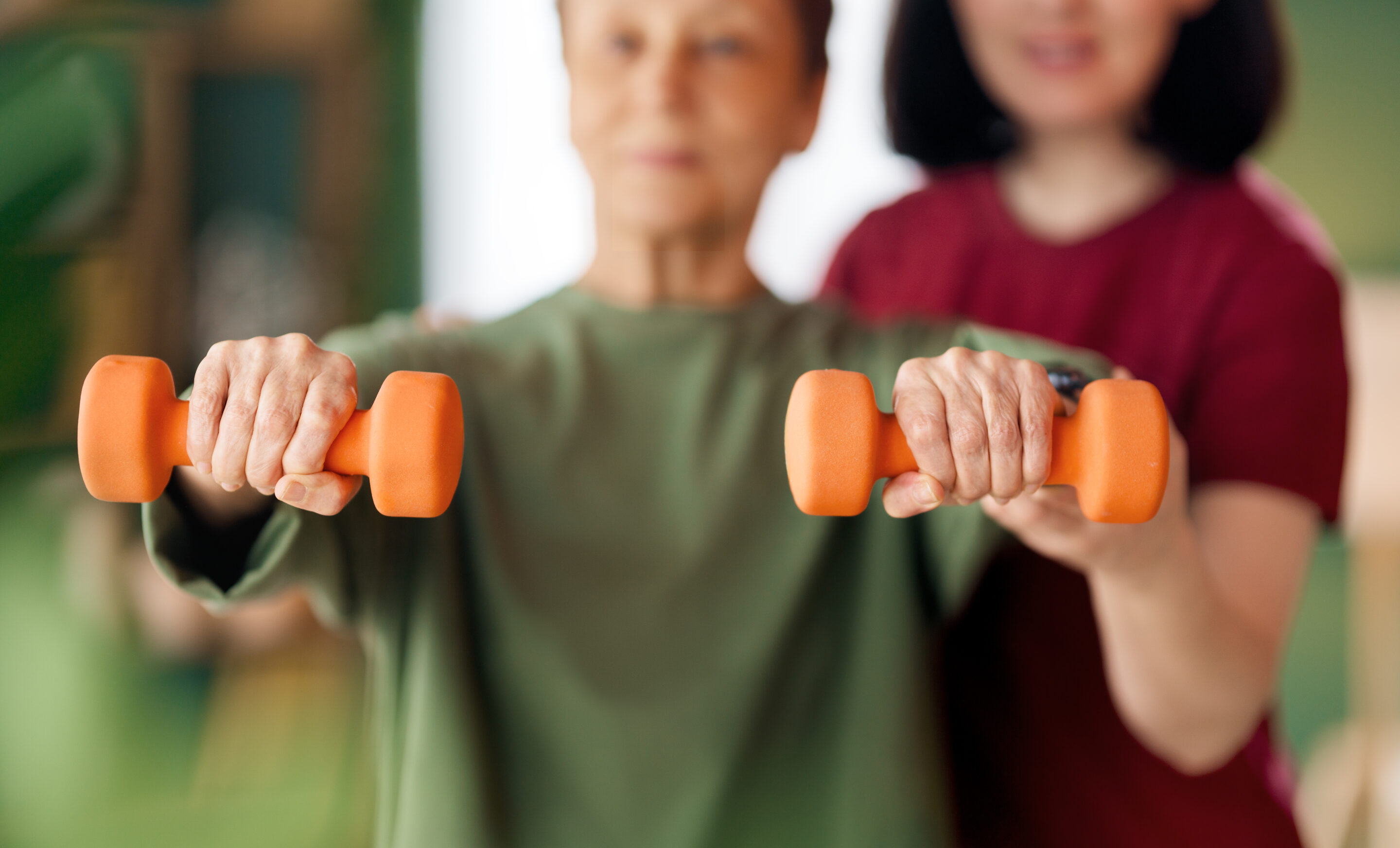 Senior woman doing dumbbell exercise